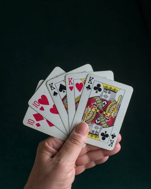 mulyajitu live baccarat table with dealer, card shoe, and betting positions